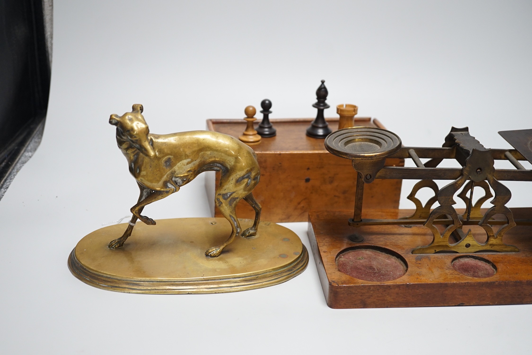 After Mene, a bronze greyhound, a Staunton-pattern chess set and a set of Victorian postal scales, bronze 22cms wide